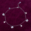 925 sterling silver butterfly and star charm anklet on dark velvet background — Ross Jewells India ₹5,850 925 sterling silver butterfly and star charm anklet on dark velvet background — Ross Jewells India ₹5,850